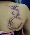 hummingbird image tattoo on back